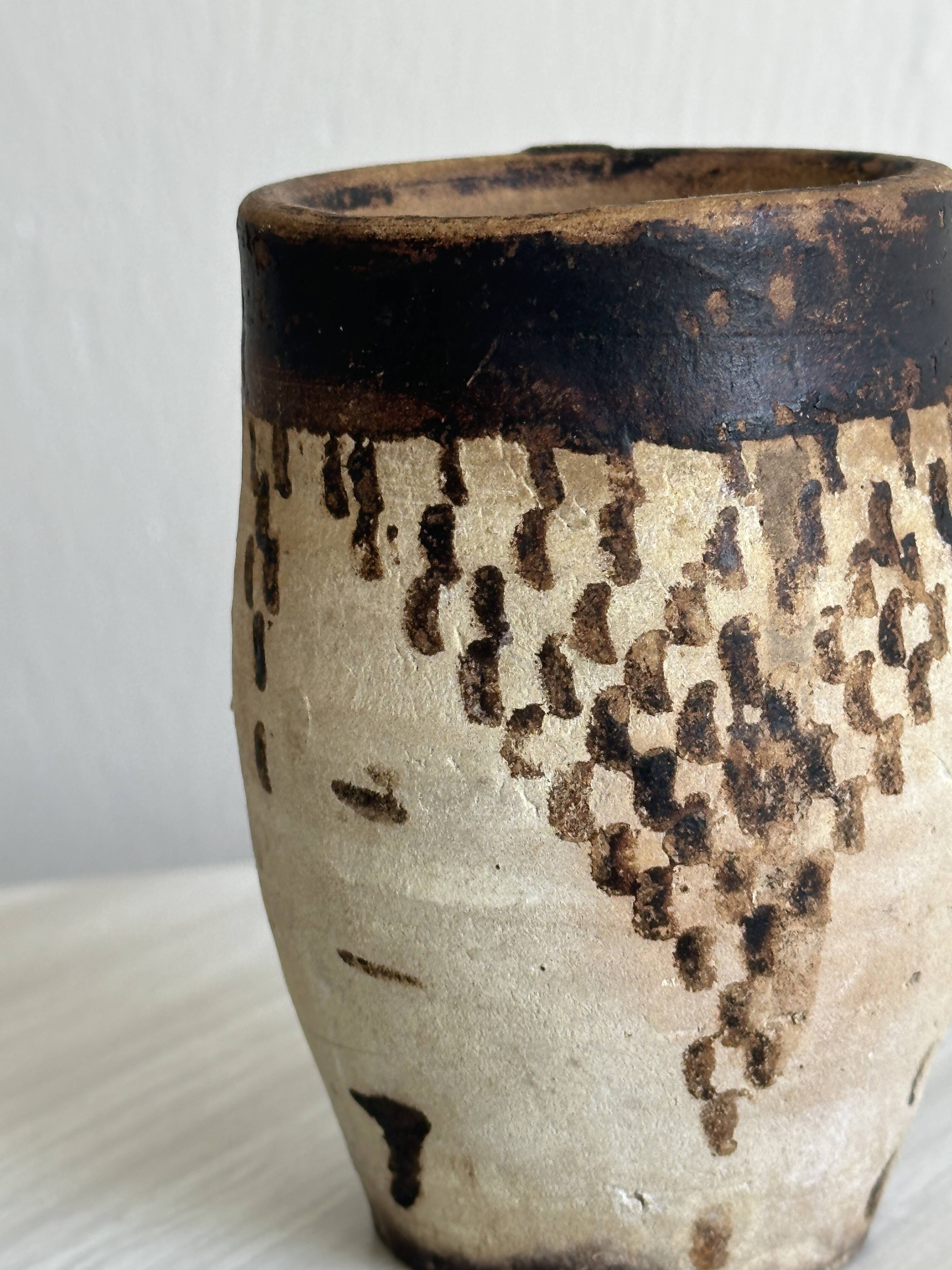 Small old terracotta cup