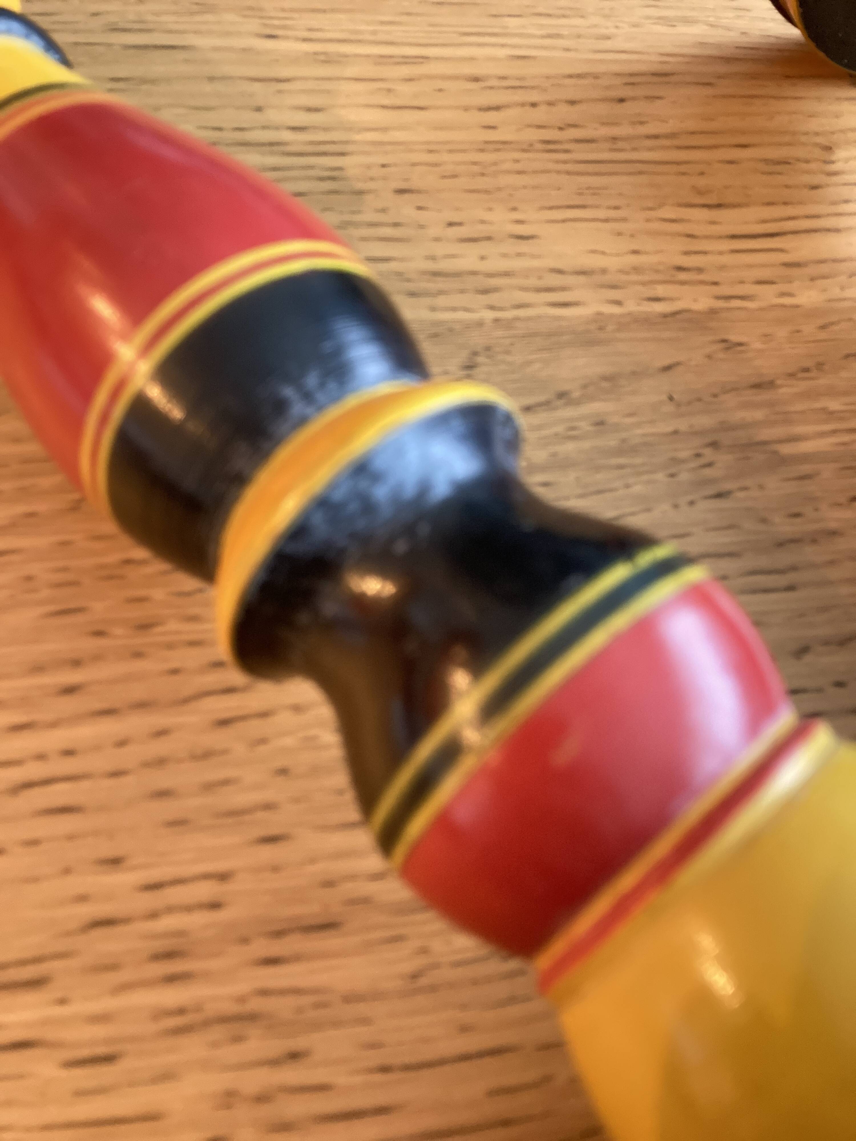 Polychrome turned wooden candlesticks