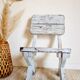 Patinated white old garden chair