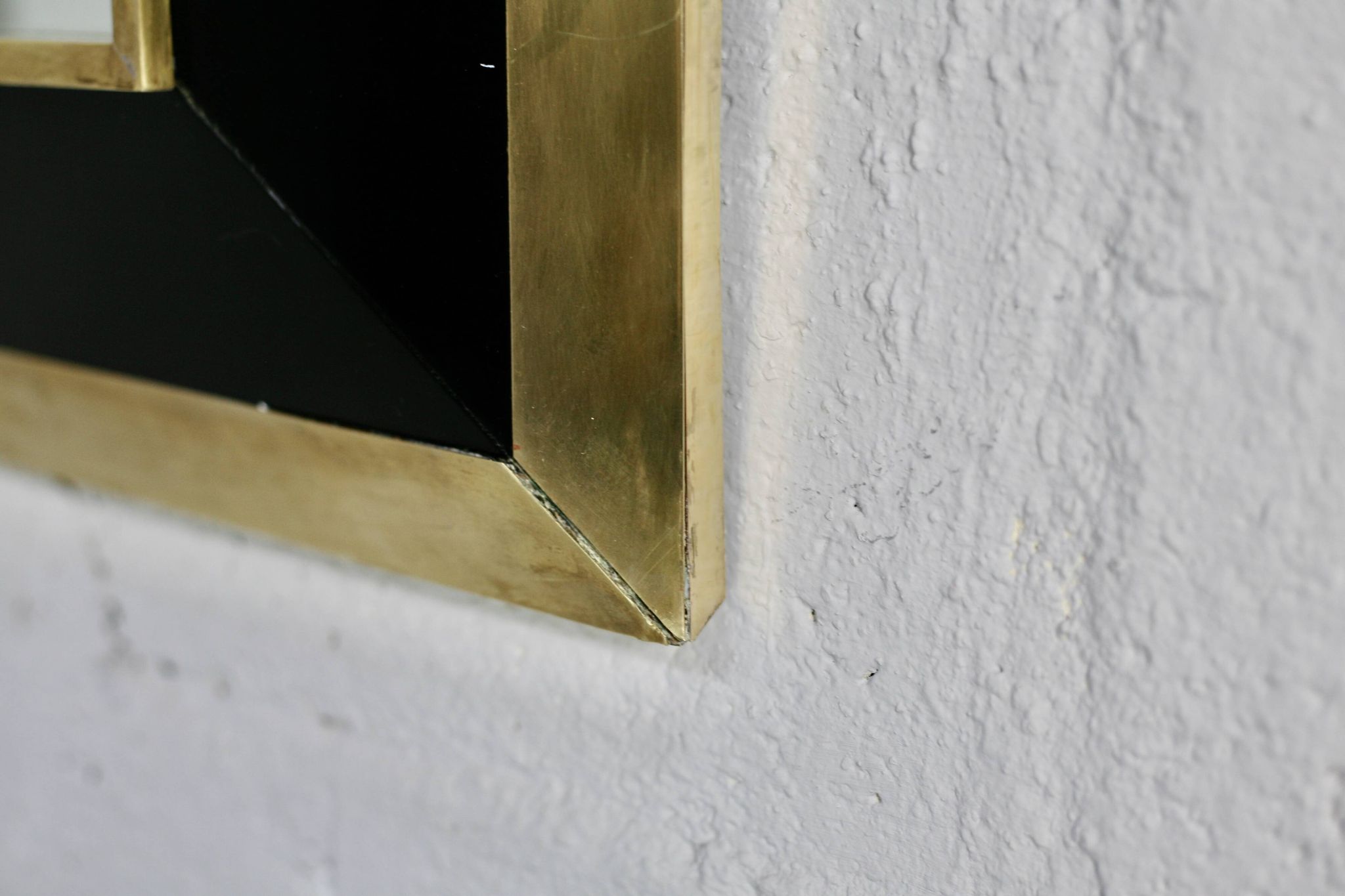 Jean-Claude Mahey mirror. Black lacquered wood and gold metal. 1970