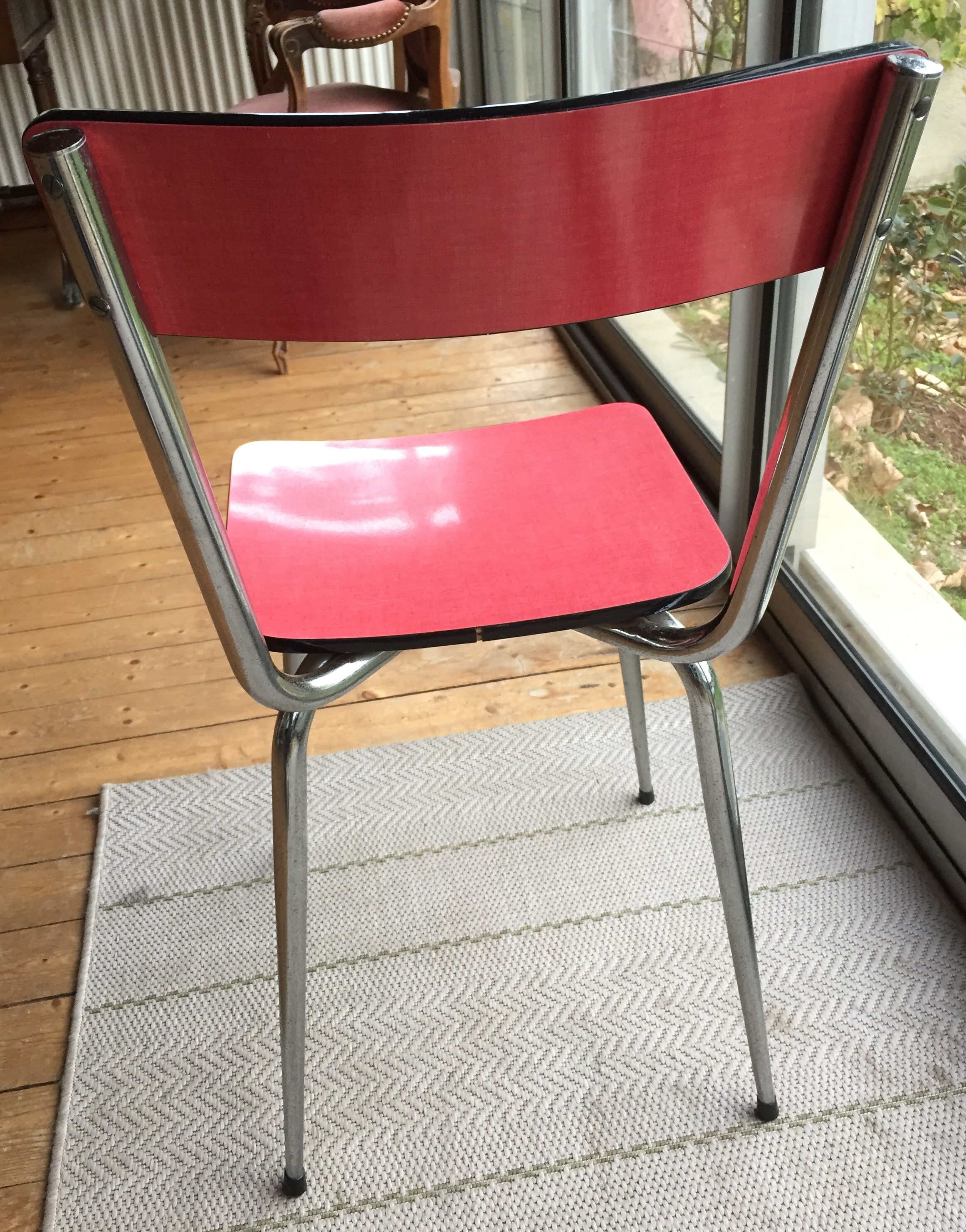 Table set and 2 vintage vintage pale red formica chairs