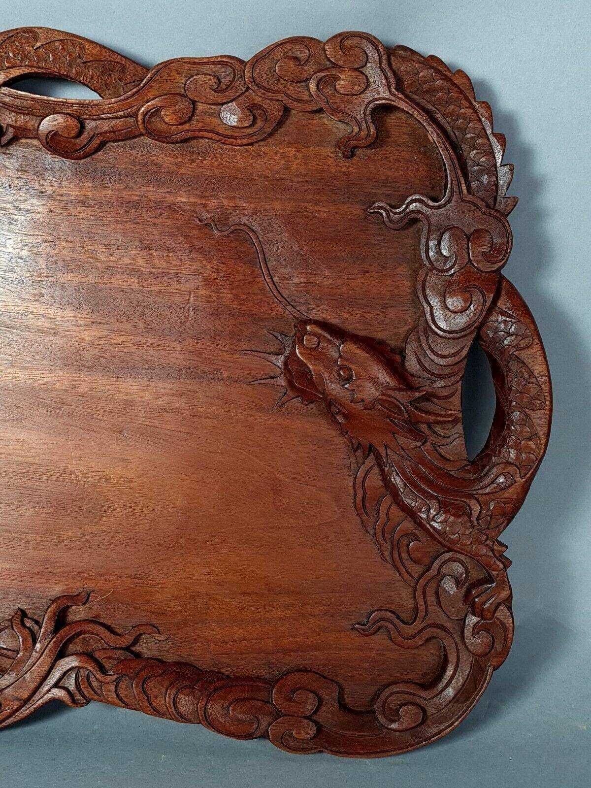 Ancient wooden tray carved with Chinese dragons around 1900