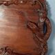 Ancient wooden tray carved with Chinese dragons around 1900