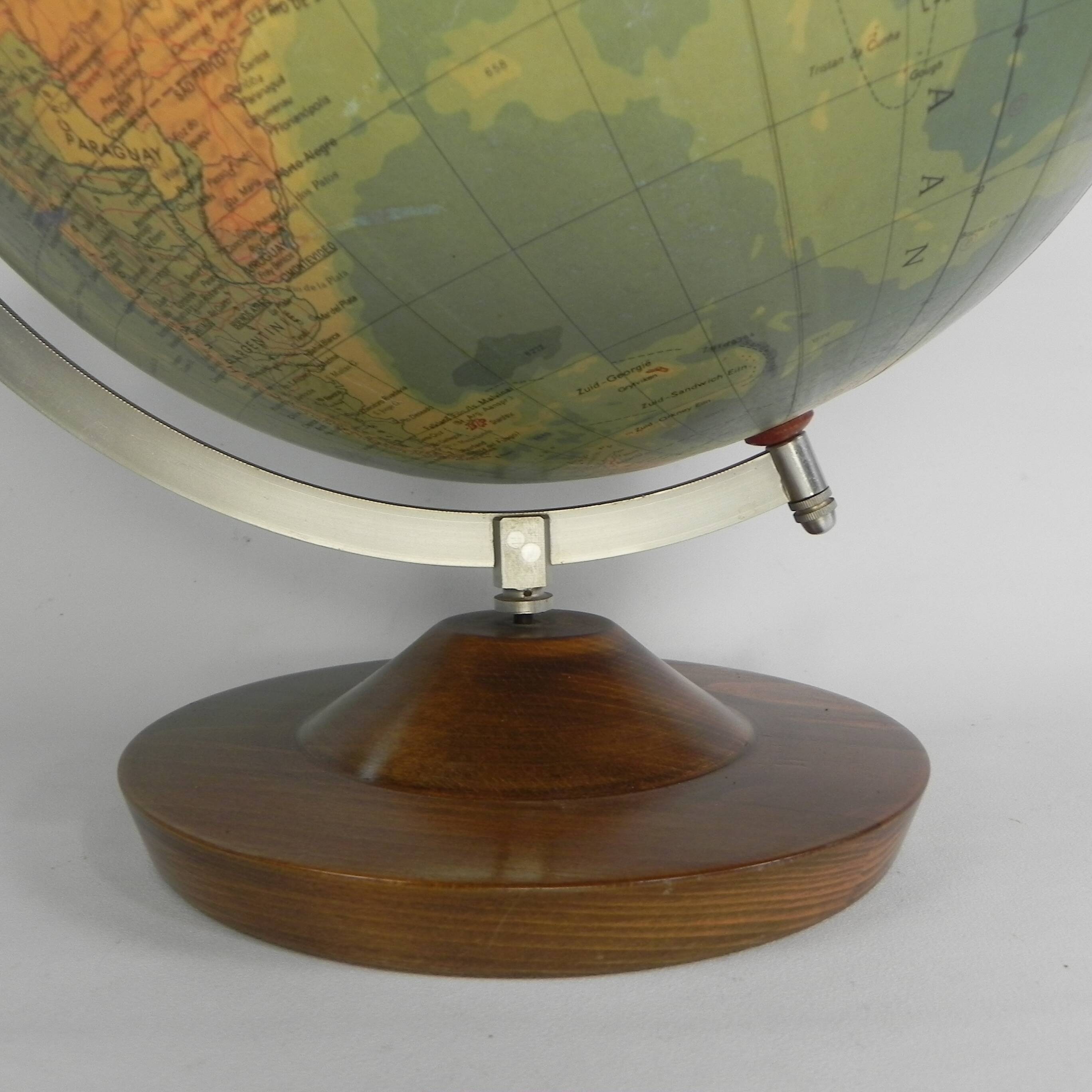 Paper mache globe on a wooden base, 1975
