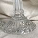 Column candle holders in moulded glass made in France.