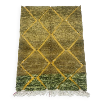 Small green Moroccan rug.