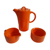 Coffee pot has orange 1970 sugar milk