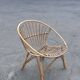 Vintage 1960s rattan shell chair – an icon of bohemian design.