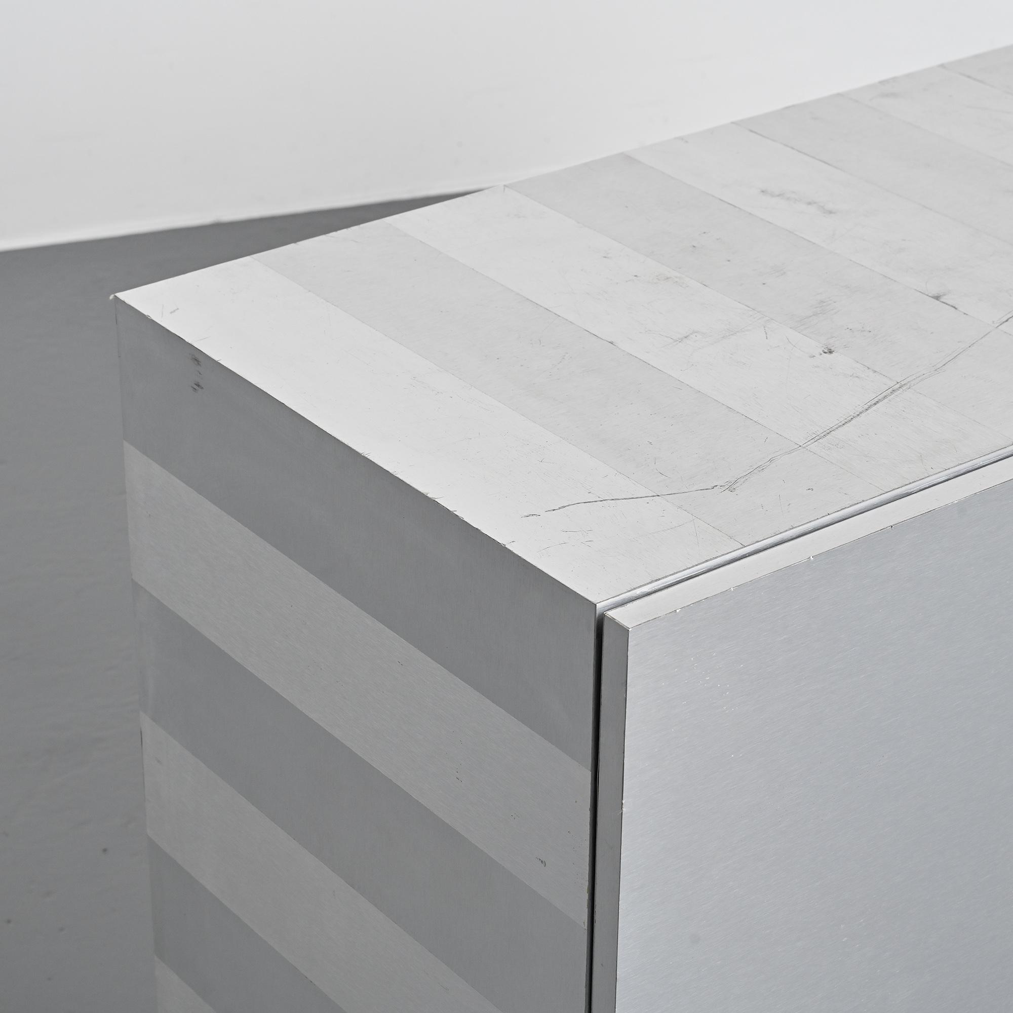 Pair of low buffets in brushed metal, French work, 1970s.