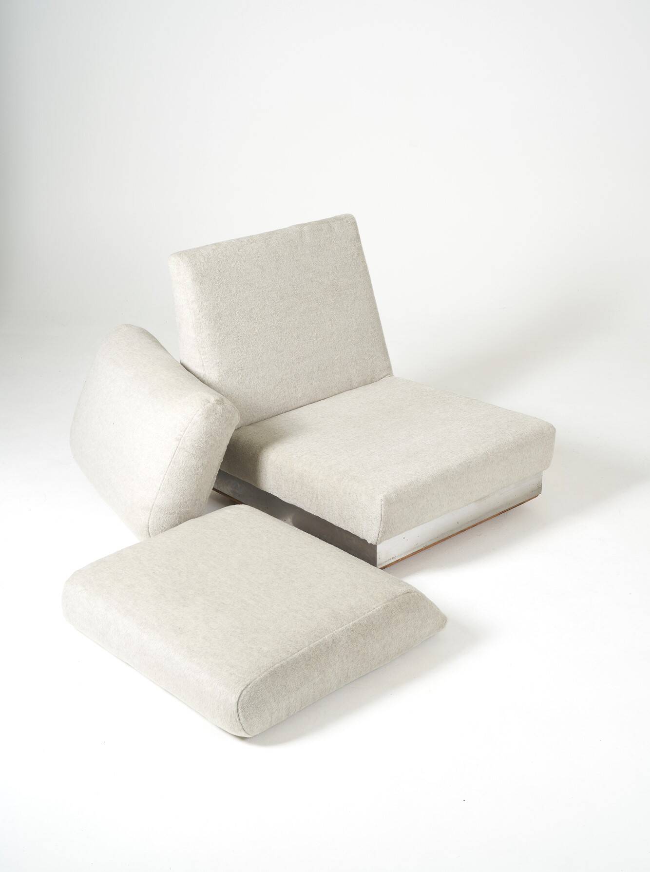 Beige fireside chair by Jacques Charpentier