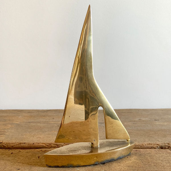 Golden brass sailboat