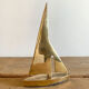 Golden brass sailboat