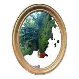 Golden oval mirror