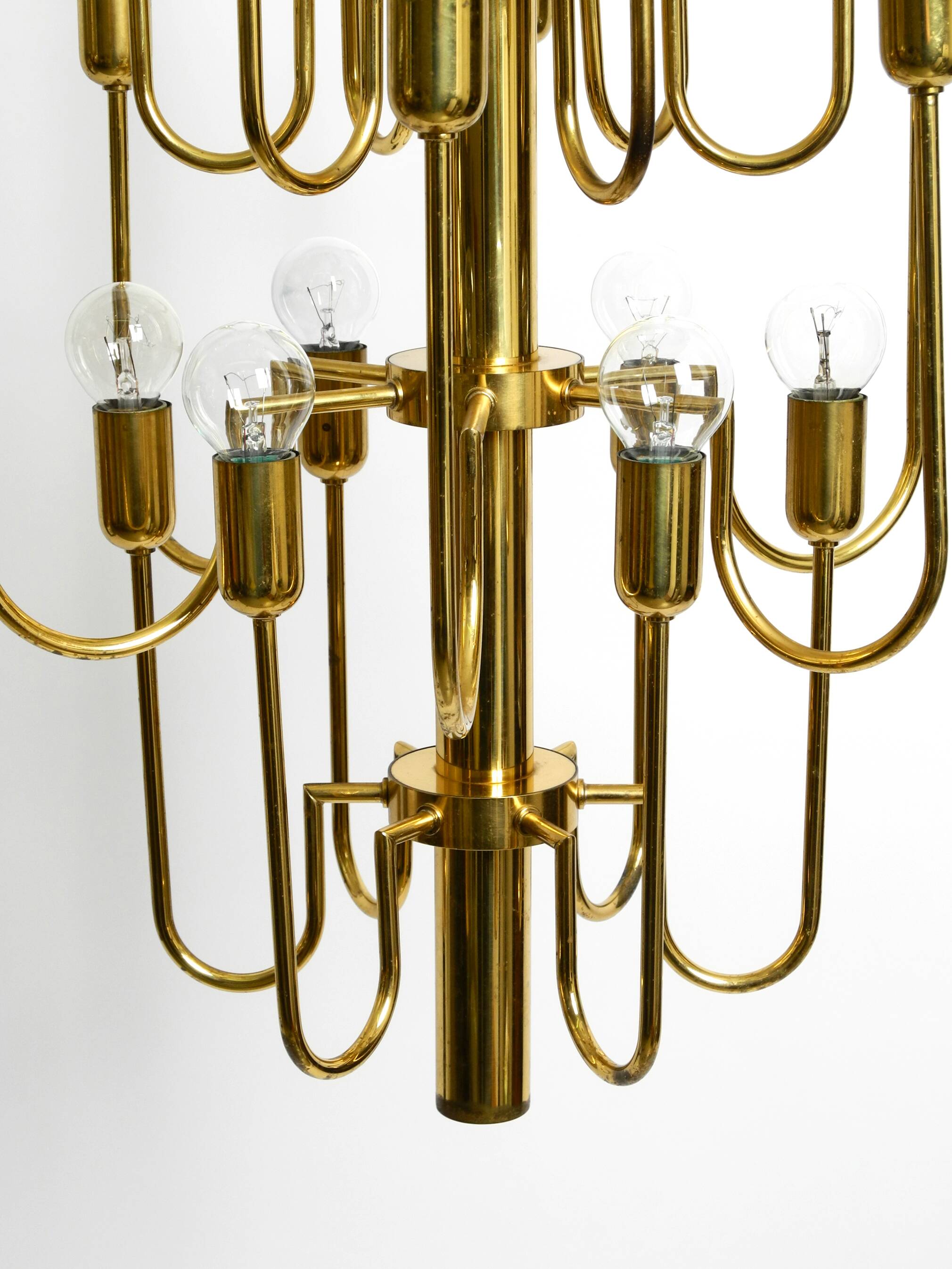 Three staged 18 arm Mid Century brass chandelier with a long brass rod