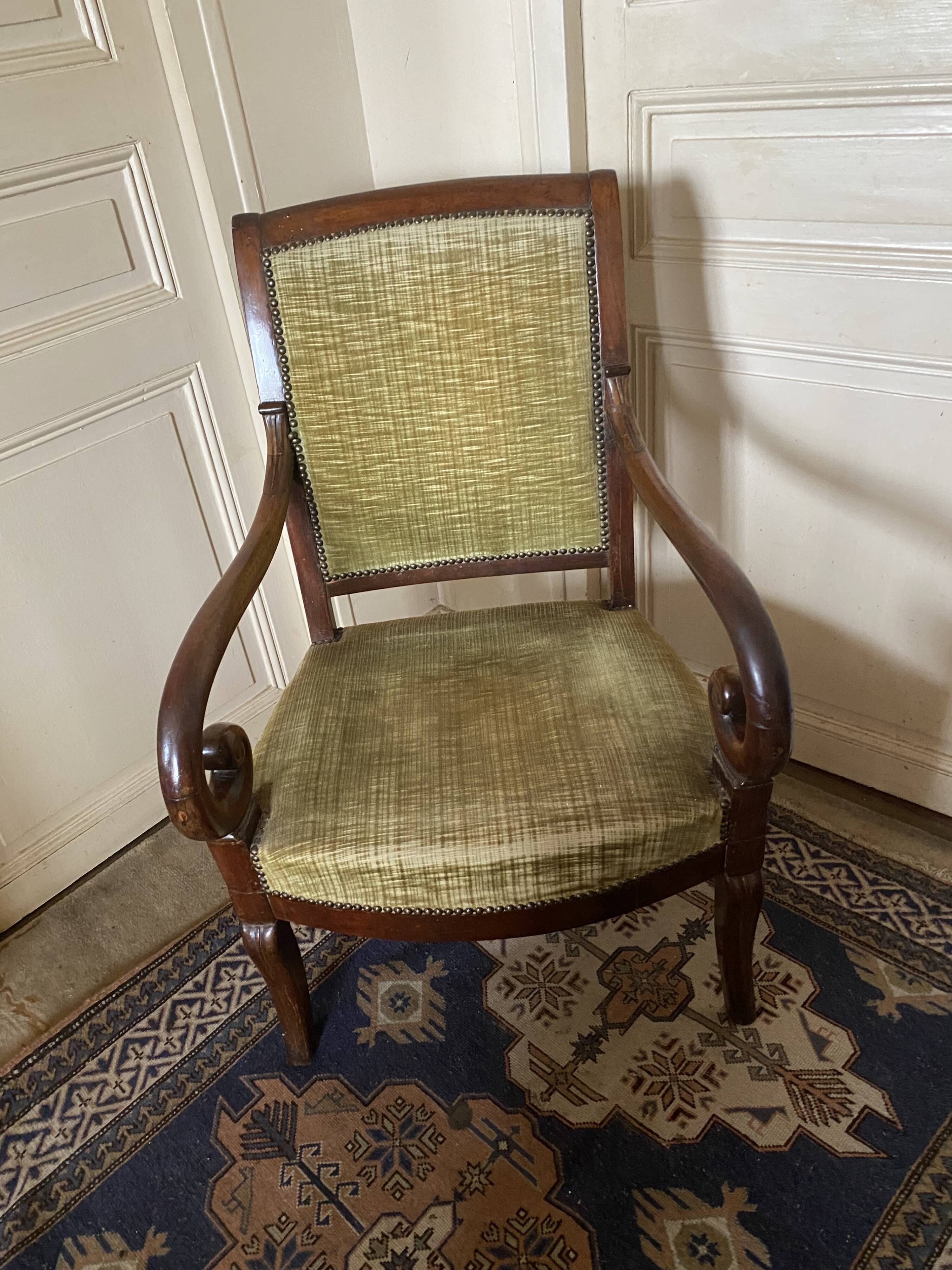Armchair with a scroll, upholstered in green velvet