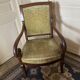Armchair with a scroll, upholstered in green velvet