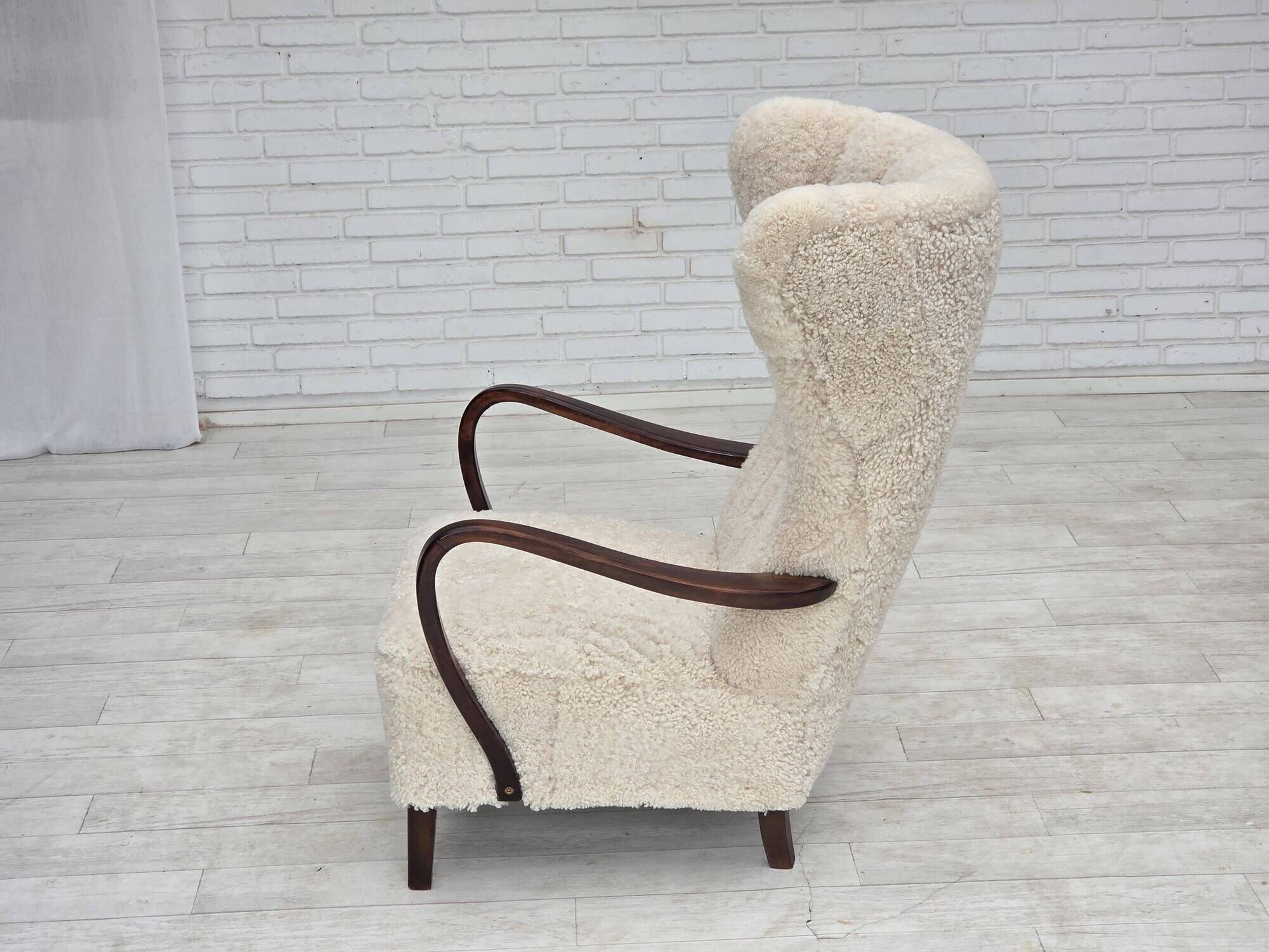 1960s, Danish high-back armchair, genuine sheepskin, reupholstered.