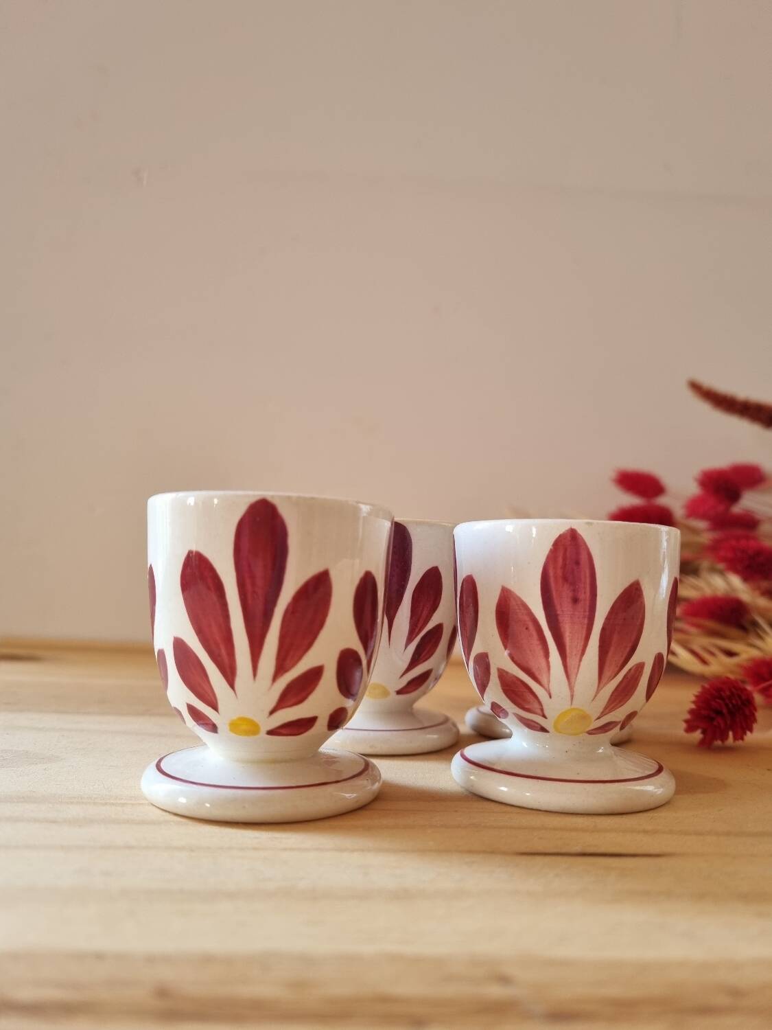 Set of four Digoin-style egg cups