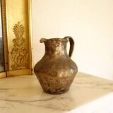 Old solid metal pitcher