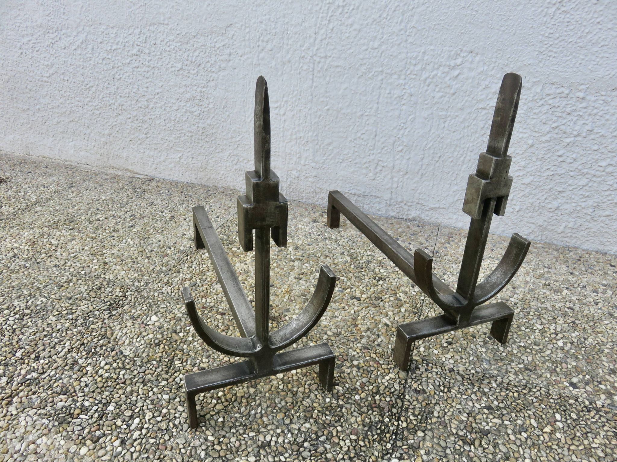 Pair of modernist andirons in forged and hammered steel, French work