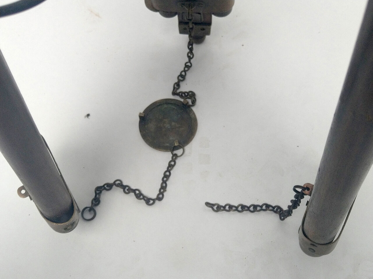 Classic lampshade on antique surveyor tripod