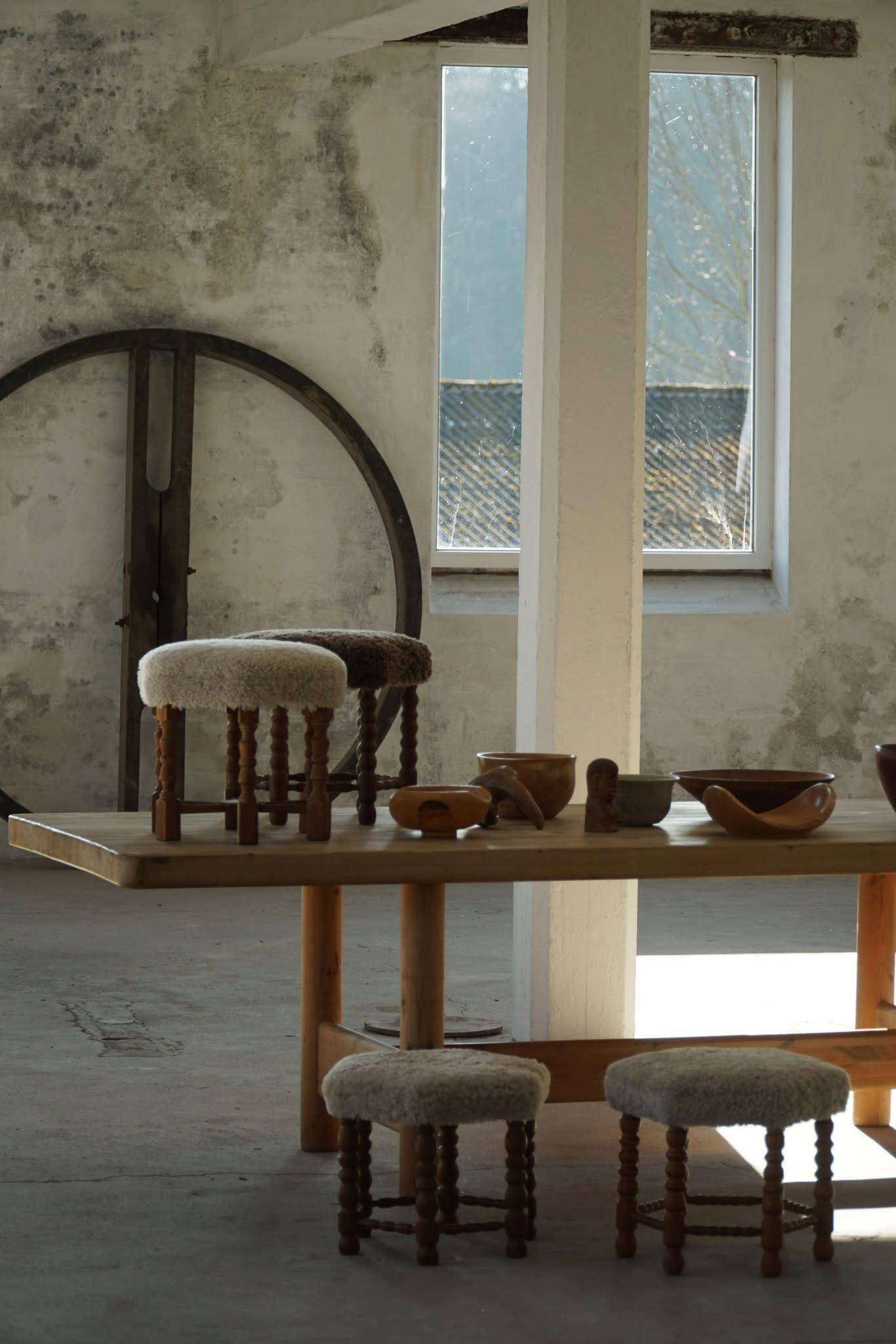 A hexagonal oak stool, seat refurbished in lambswool, Danish design from the 1950s.