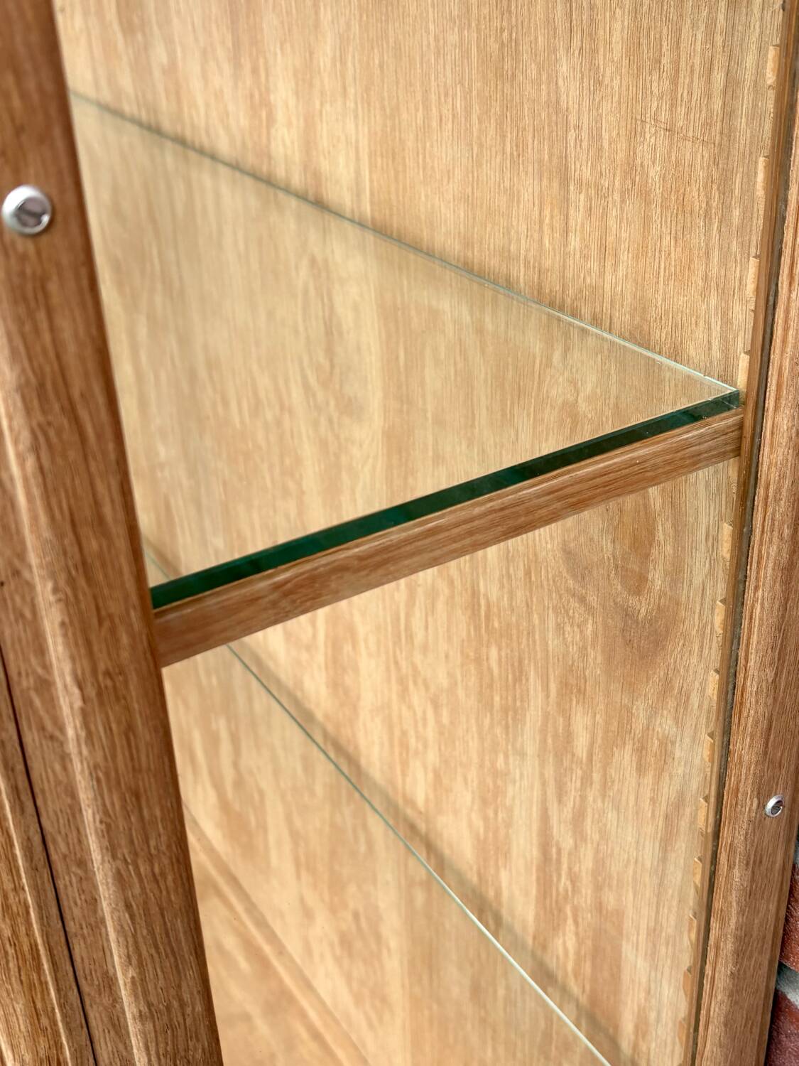 Restored antique oak display cabinet with glass shelves.