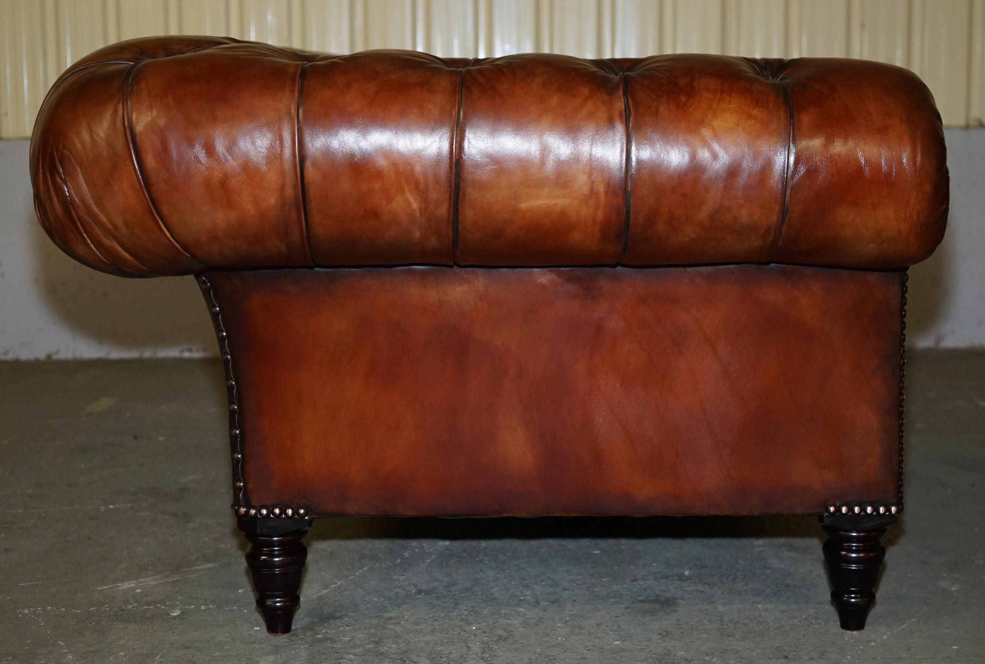 Pair of Early Victorian leather Chesterfield sofas by George Smith.