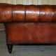 Pair of Early Victorian leather Chesterfield sofas by George Smith.