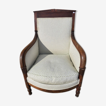 Fauteuil empire bergere en noyer foncé du XIXème siecle