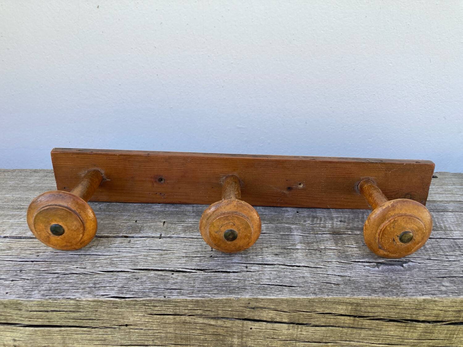 Old wooden wall coat rack