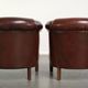 Set of 2 sheepskin club armchairs in a dark cognac colour