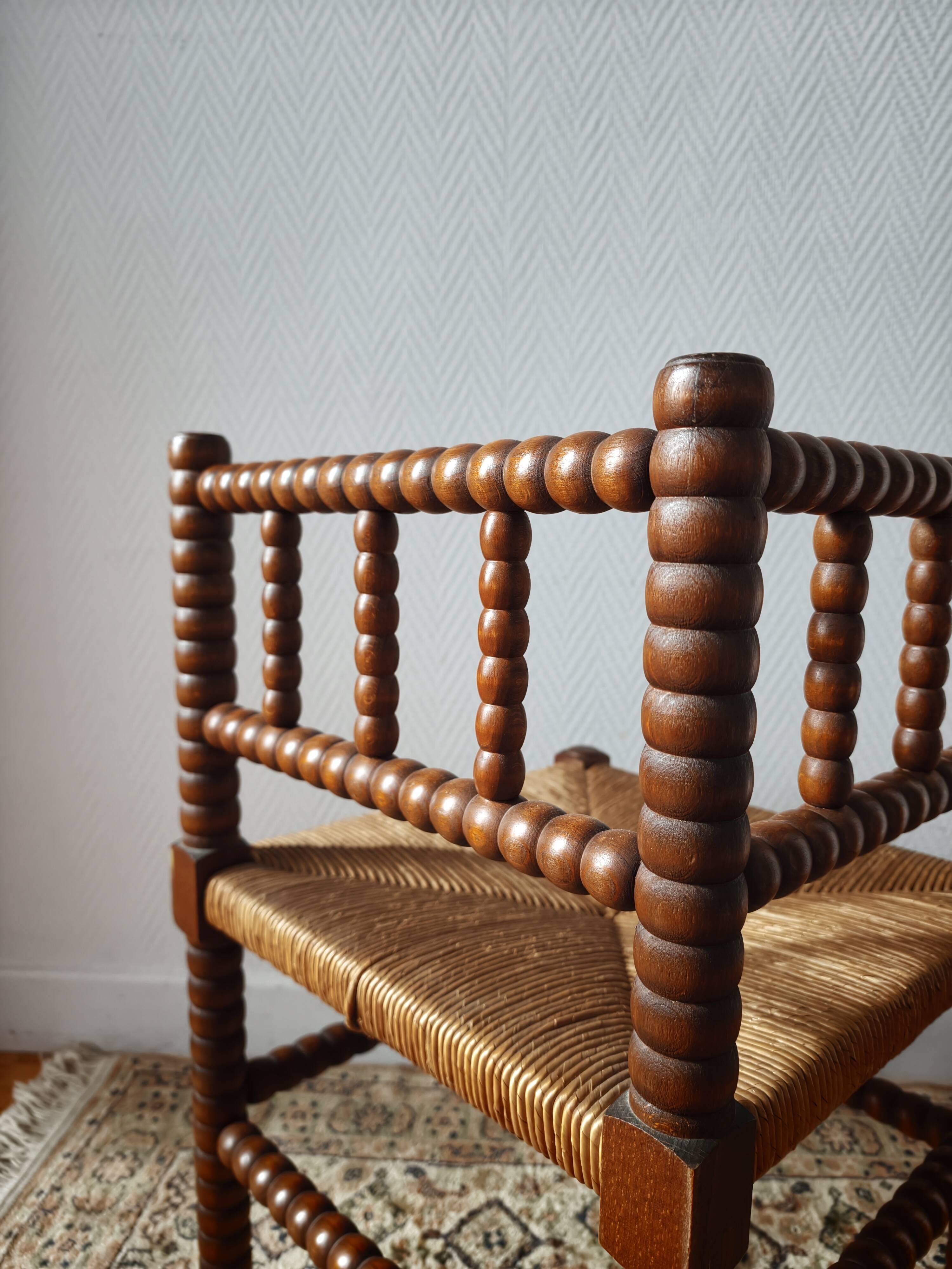 Chaise vintage coin du feu en bois tourné bobine