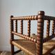 Chaise vintage coin du feu en bois tourné bobine