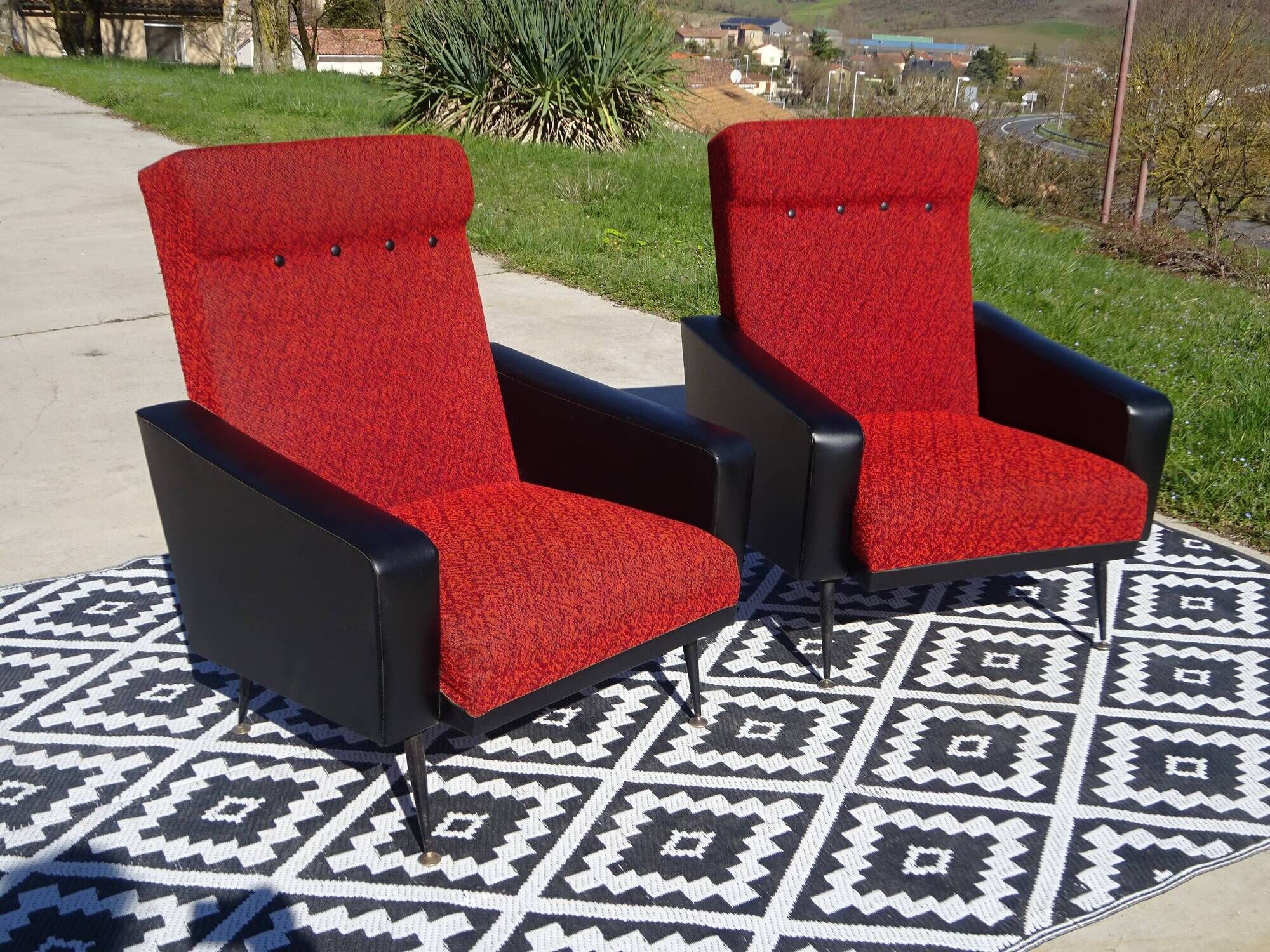 Vintage pair of red and black armchairs