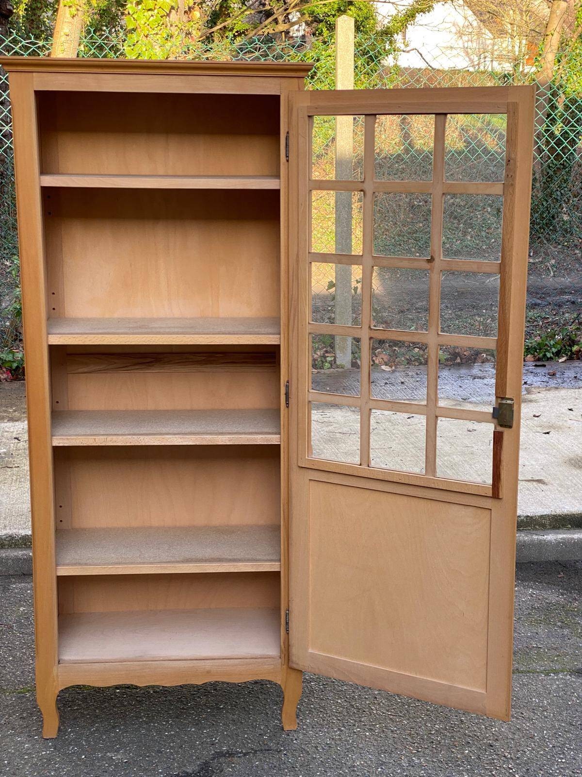 Parisian glass-fronted wardrobe in light wood from the 1960s.