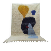 Handwoven traditional artisan rug with colourful patterns.