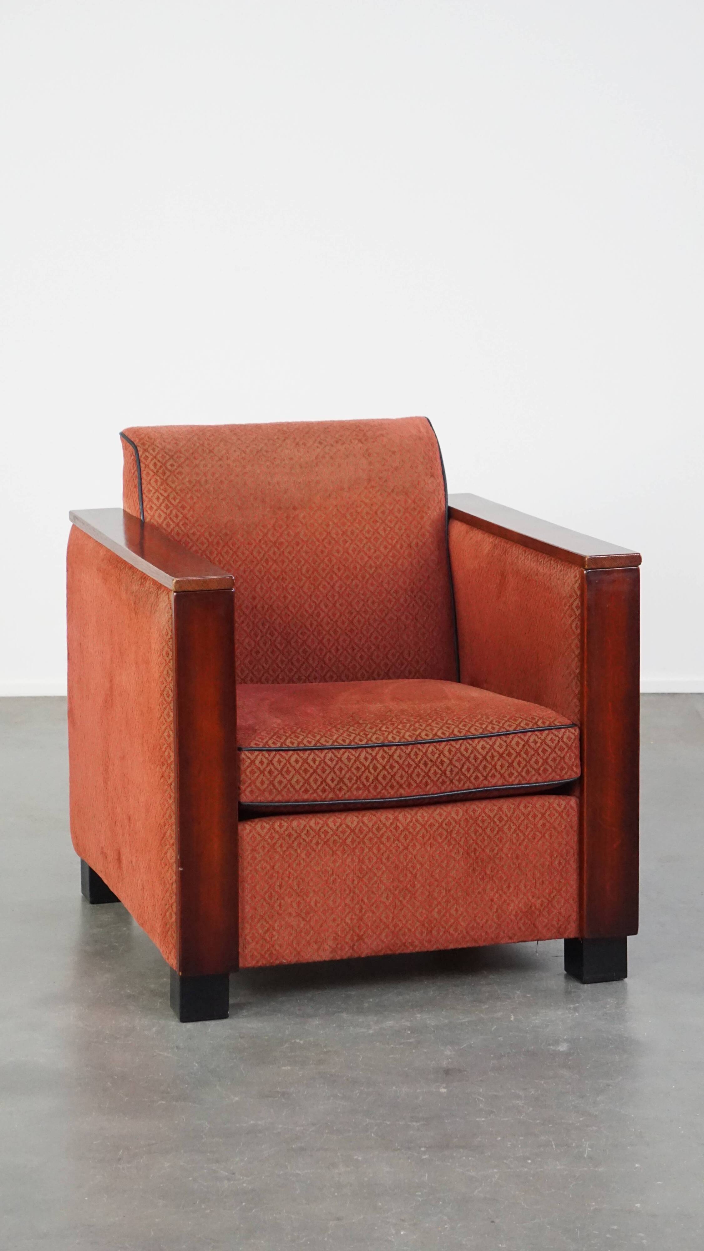 Art Deco design armchair with red fabric upholstery and wooden details