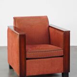 Art Deco design armchair with red fabric upholstery and wooden details