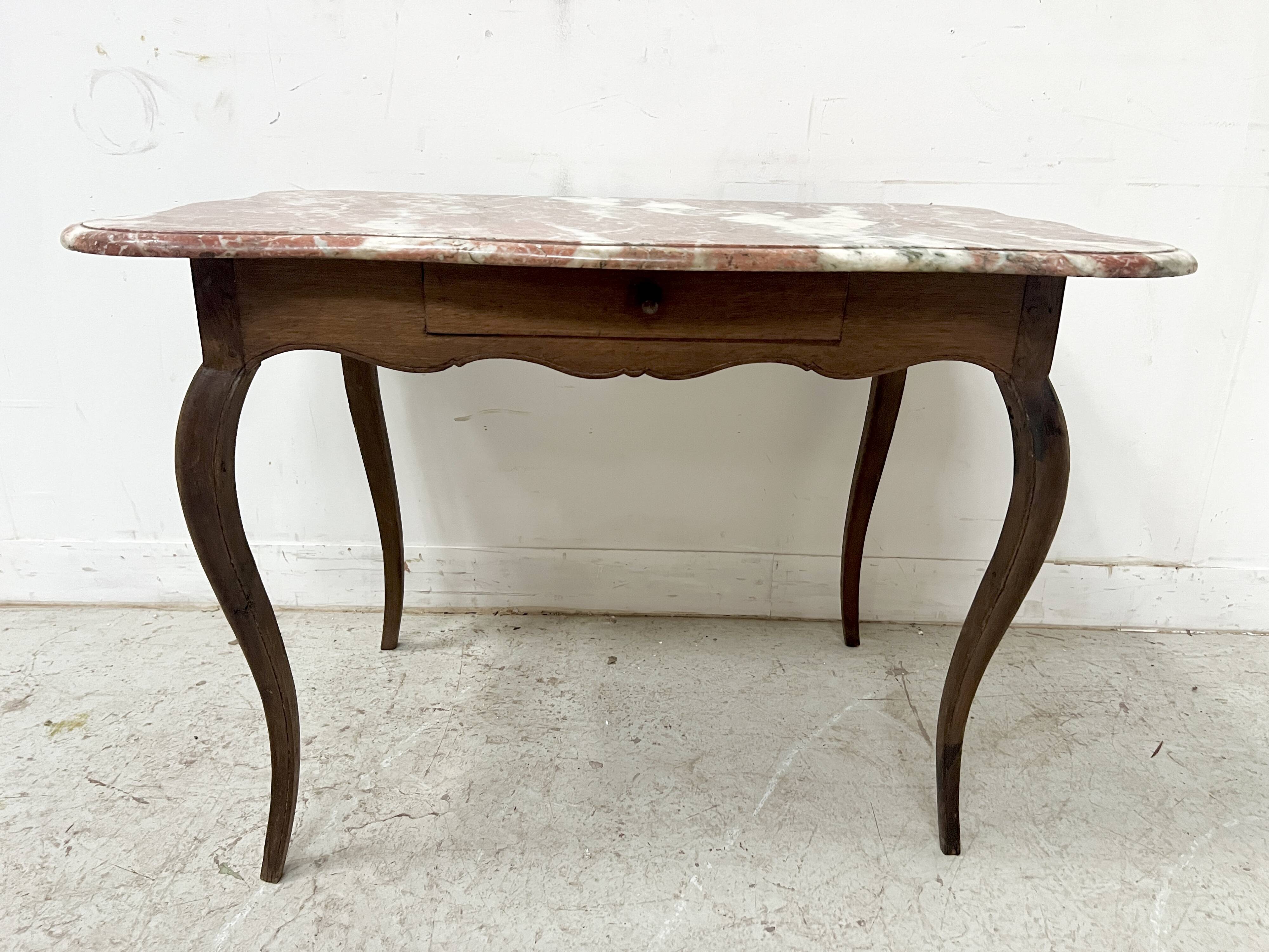Louis XV mid-table in oak and marble, 18th century.