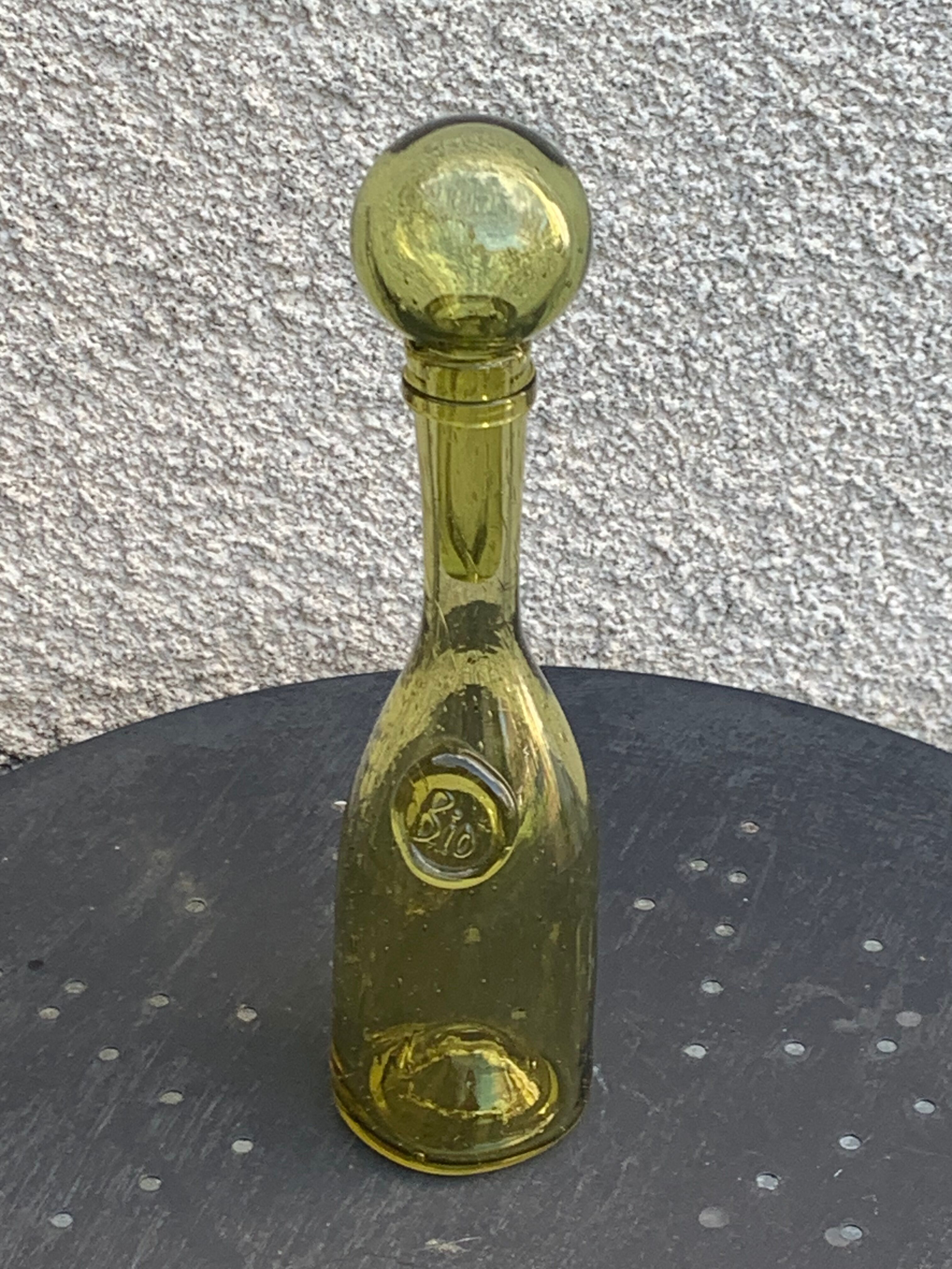 Glassblown glass decanter from the Biot collector glassworks
