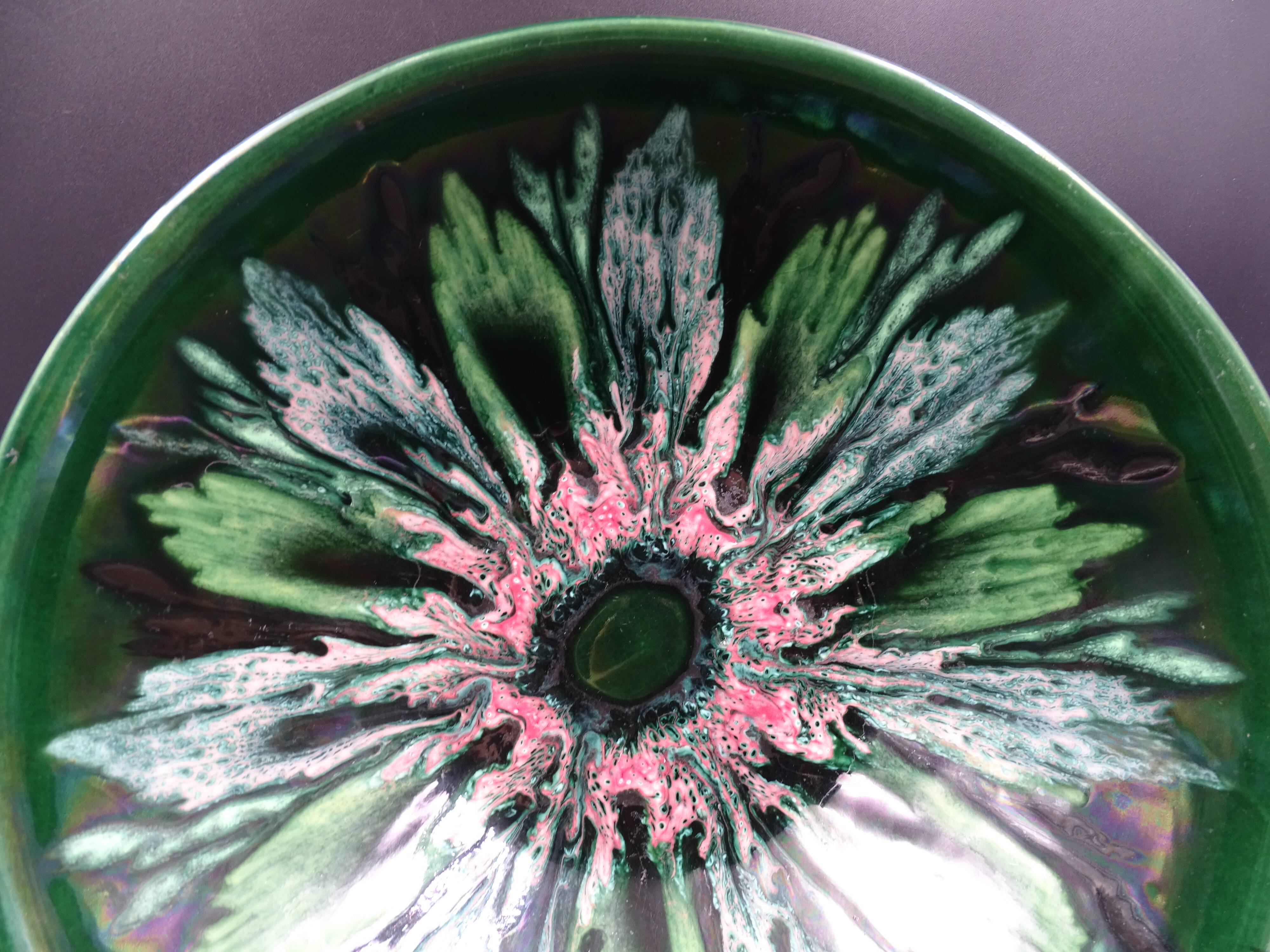 Green faience bowl decorated with multicolored drips around 1970
