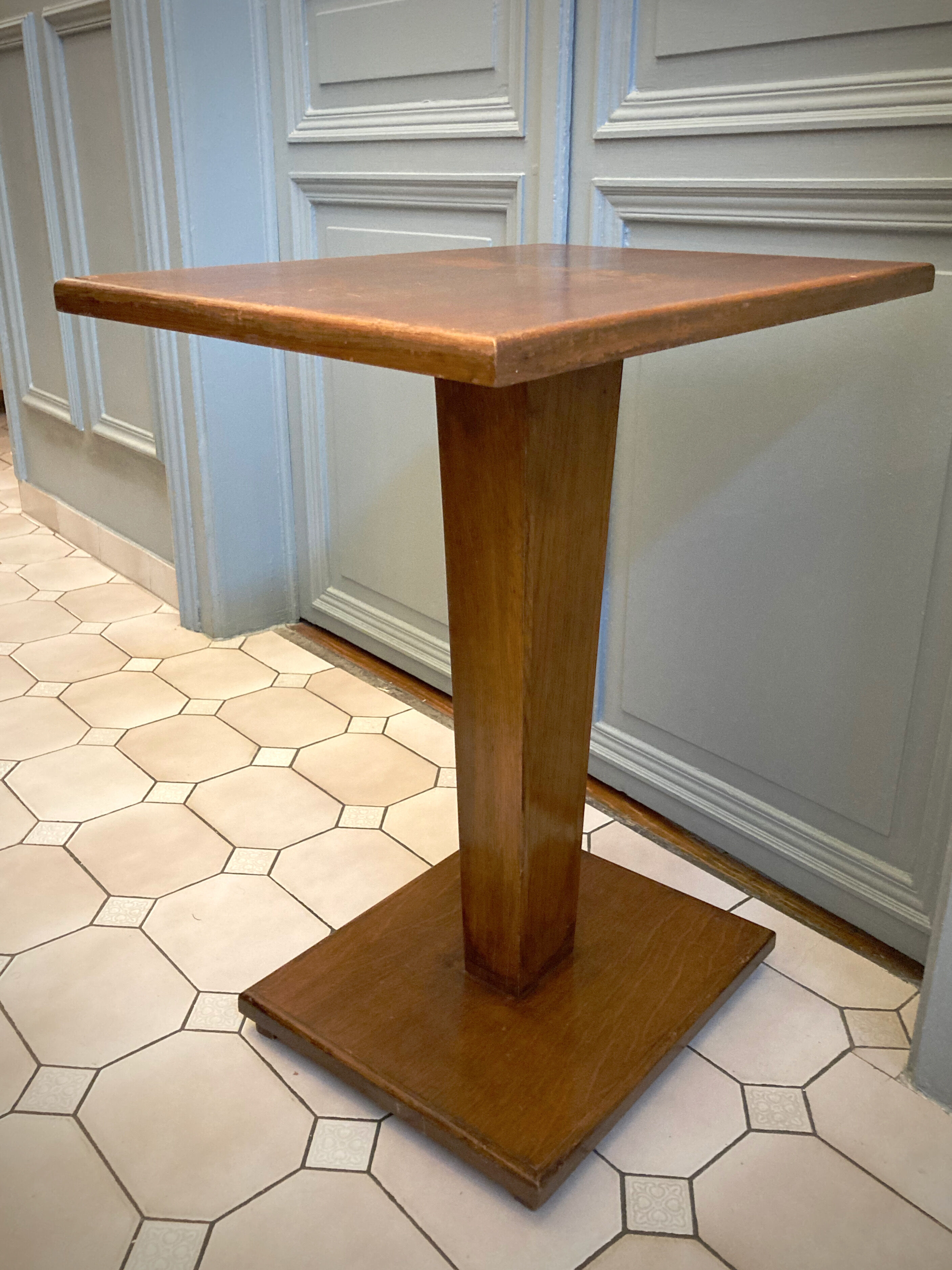 Square pedestal table with central foot 1930
