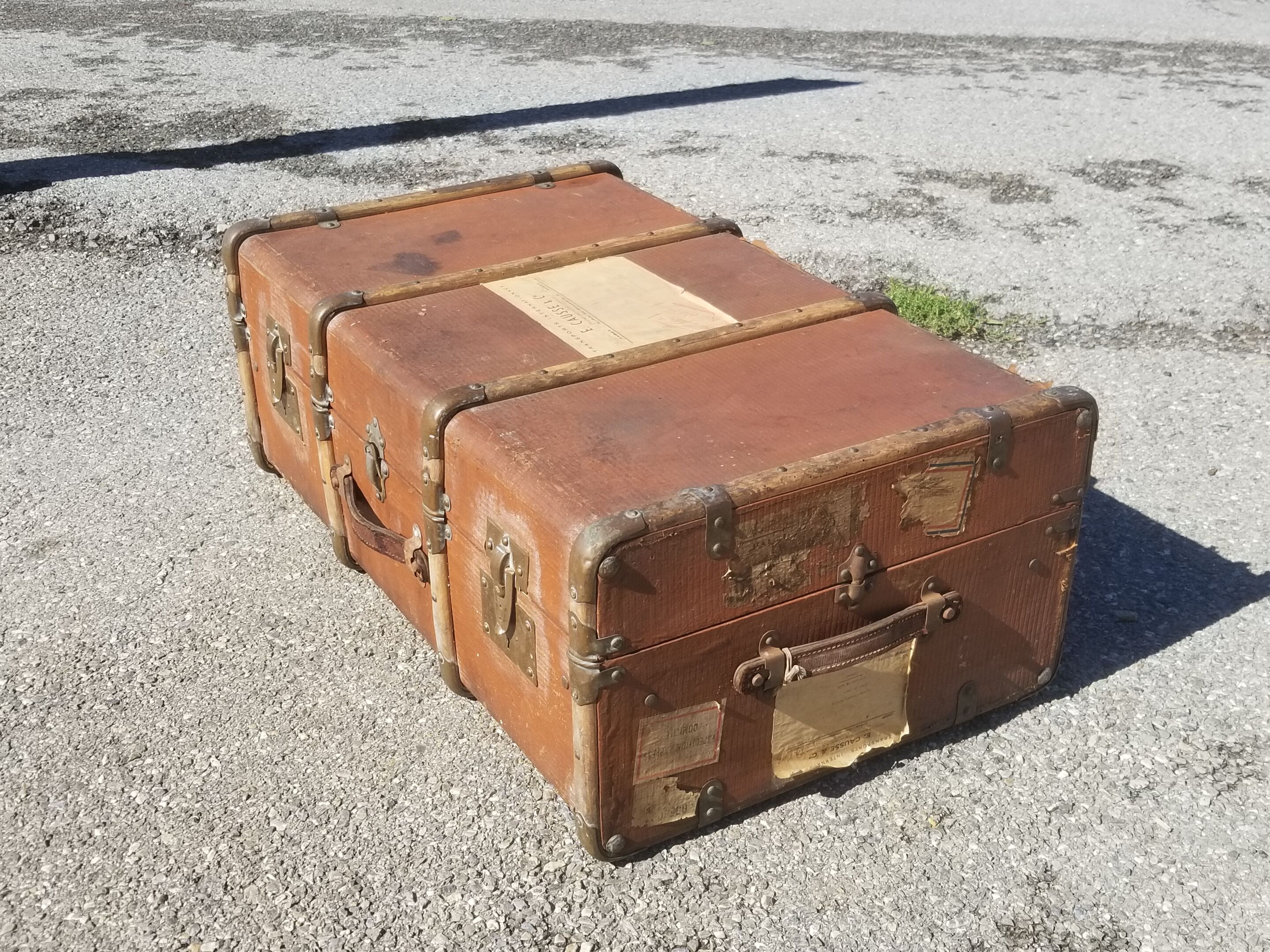 Old travel trunk made of wood and brass