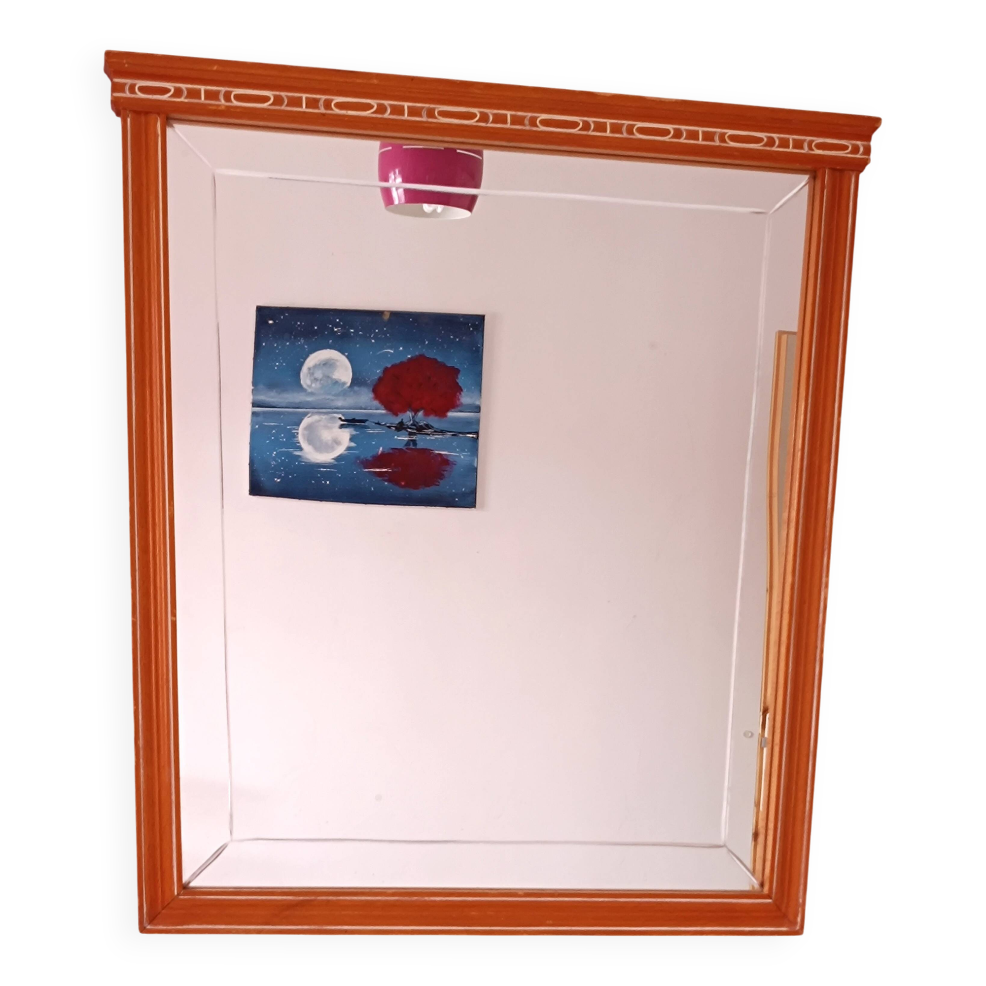 Beveled glass wall mirror in solid wood frame