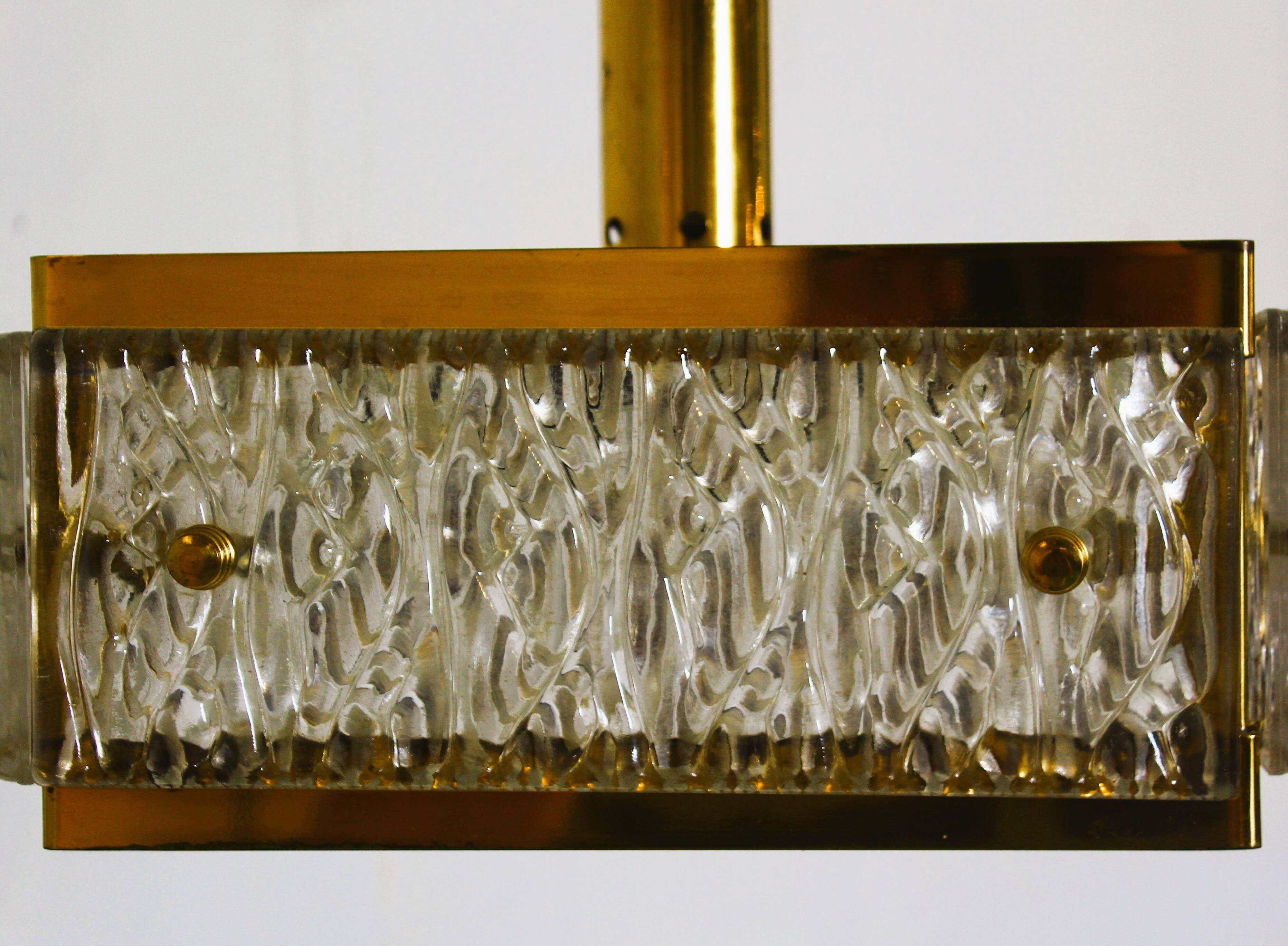 Vintage chandelier from Malmö Metallvarufabrik and pressed glass from Orrefors 1970s