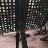 Vintage green perforated metal public bench