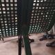 Vintage green perforated metal public bench