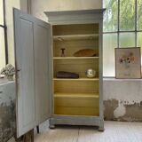 Blue patinated cap cabinet