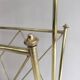 Neoclassical style magazine rack in brass with glass shelf by Maison Jansen